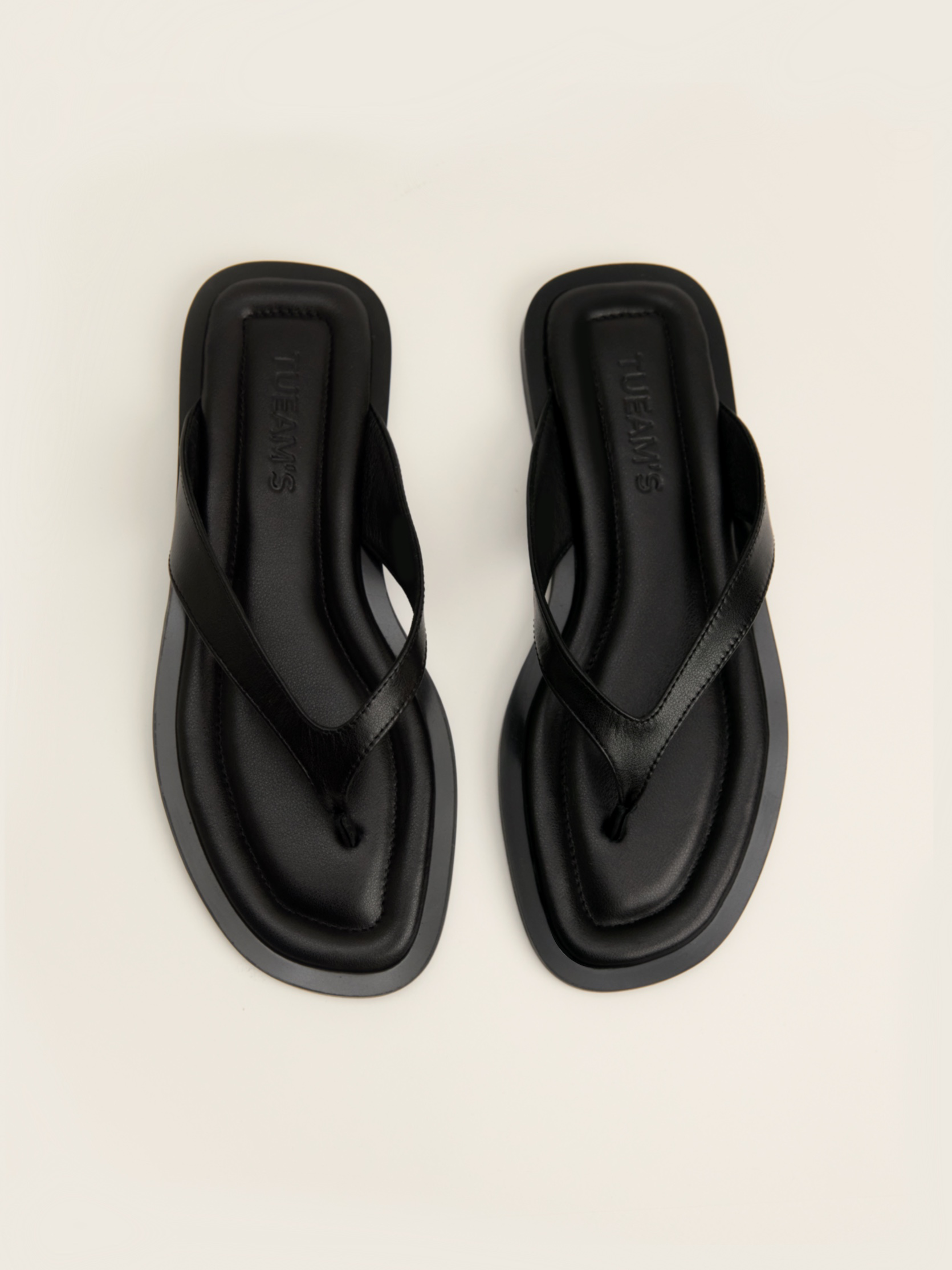 The flip-flop flat in black leather