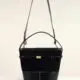 Bucket bag made of suede and leather in black color